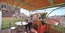 En mysig lägenhet med rymlig takterrass i La Pigna