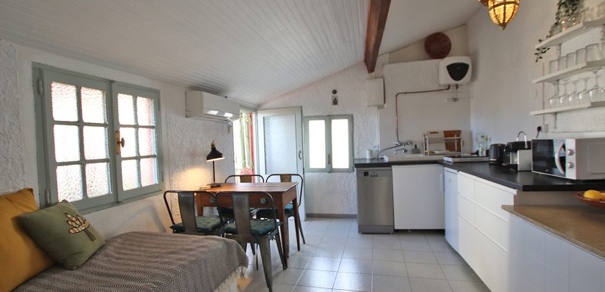 En mysig lägenhet med rymlig takterrass i La Pigna